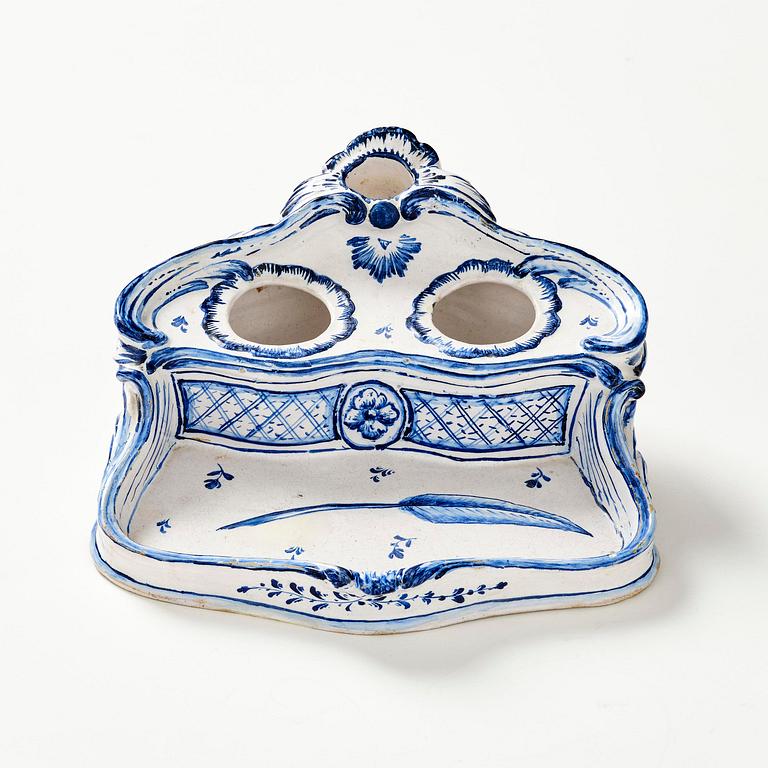 A Swedish unmarked Rörstrand rococo faience desk set, 18th century.