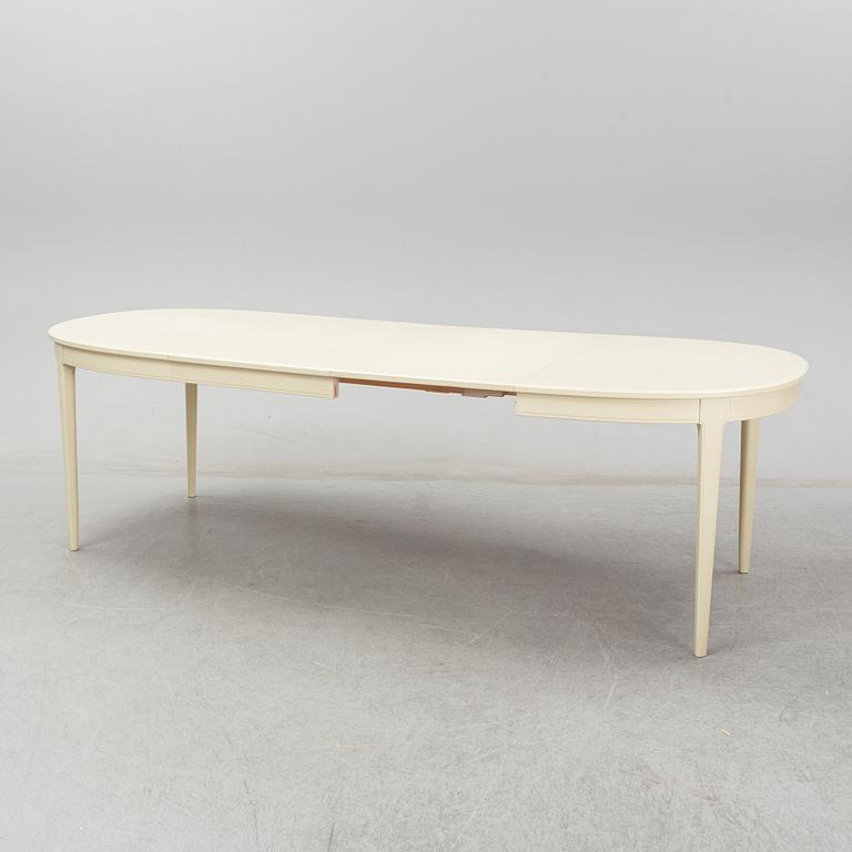 A dining table with six chairs by Carl Malmsten. Second half of the 20th Century.