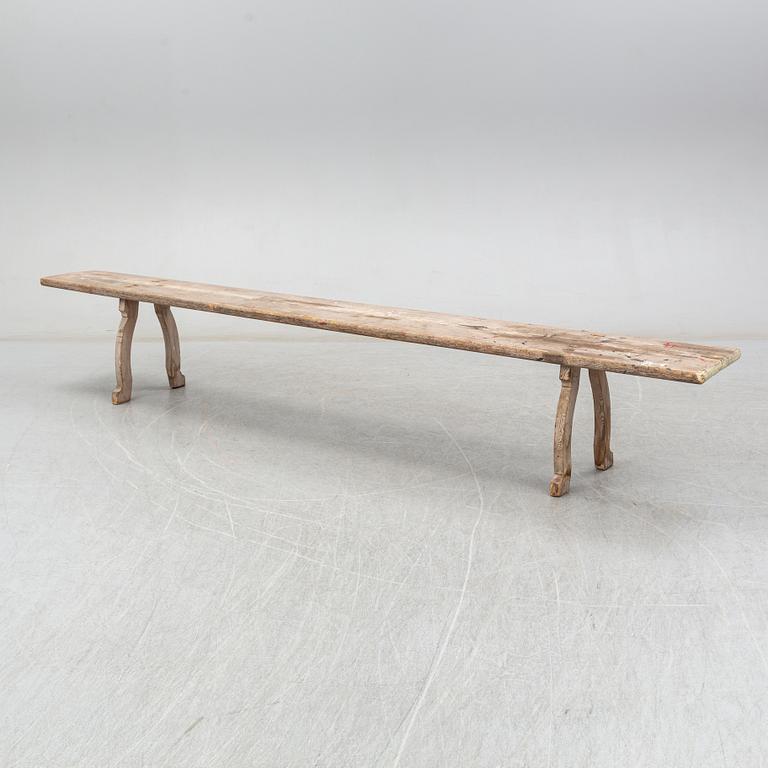 A pine bench, 19th Century.