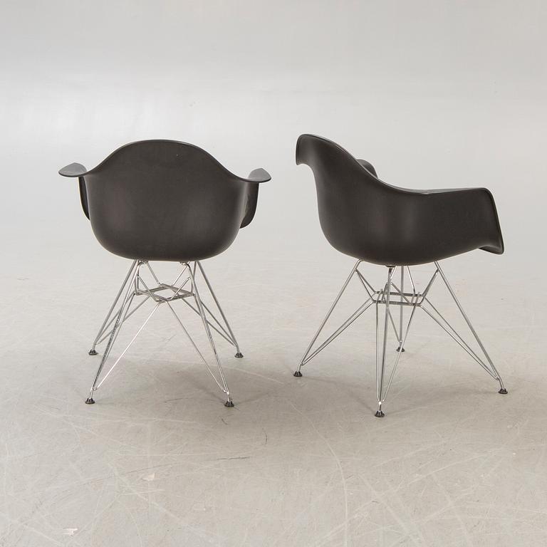 Charles and Ray Eames, armchairs a pair of "Eames plastic chair - DAR" for Vitra 2010.