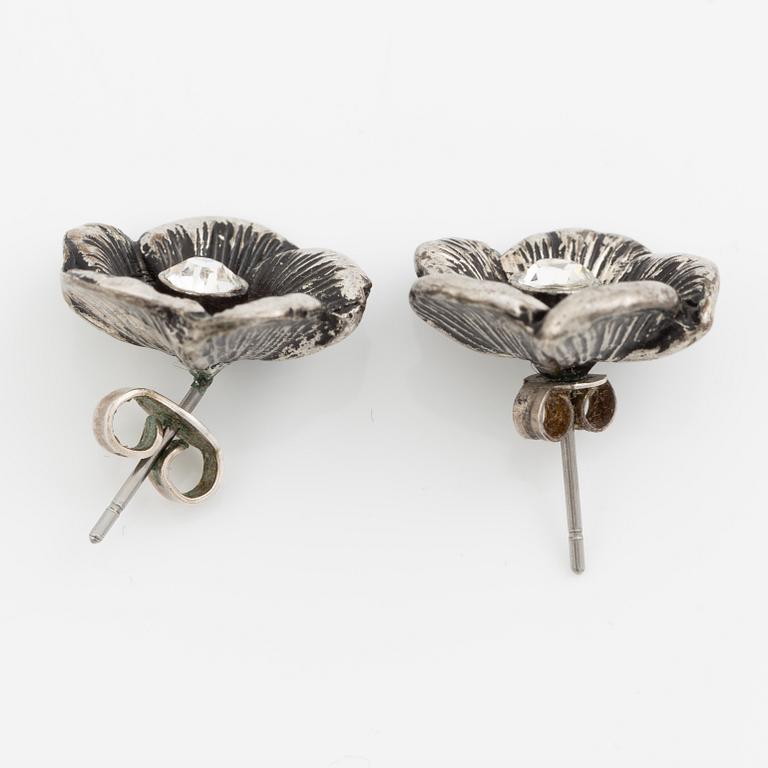 Necklace with matching earrings, white metal in floral design with glass stones.