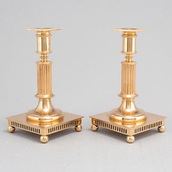 A pair of model 38 brass candlesticks from Gusums Bruk, first half of the 20th century.