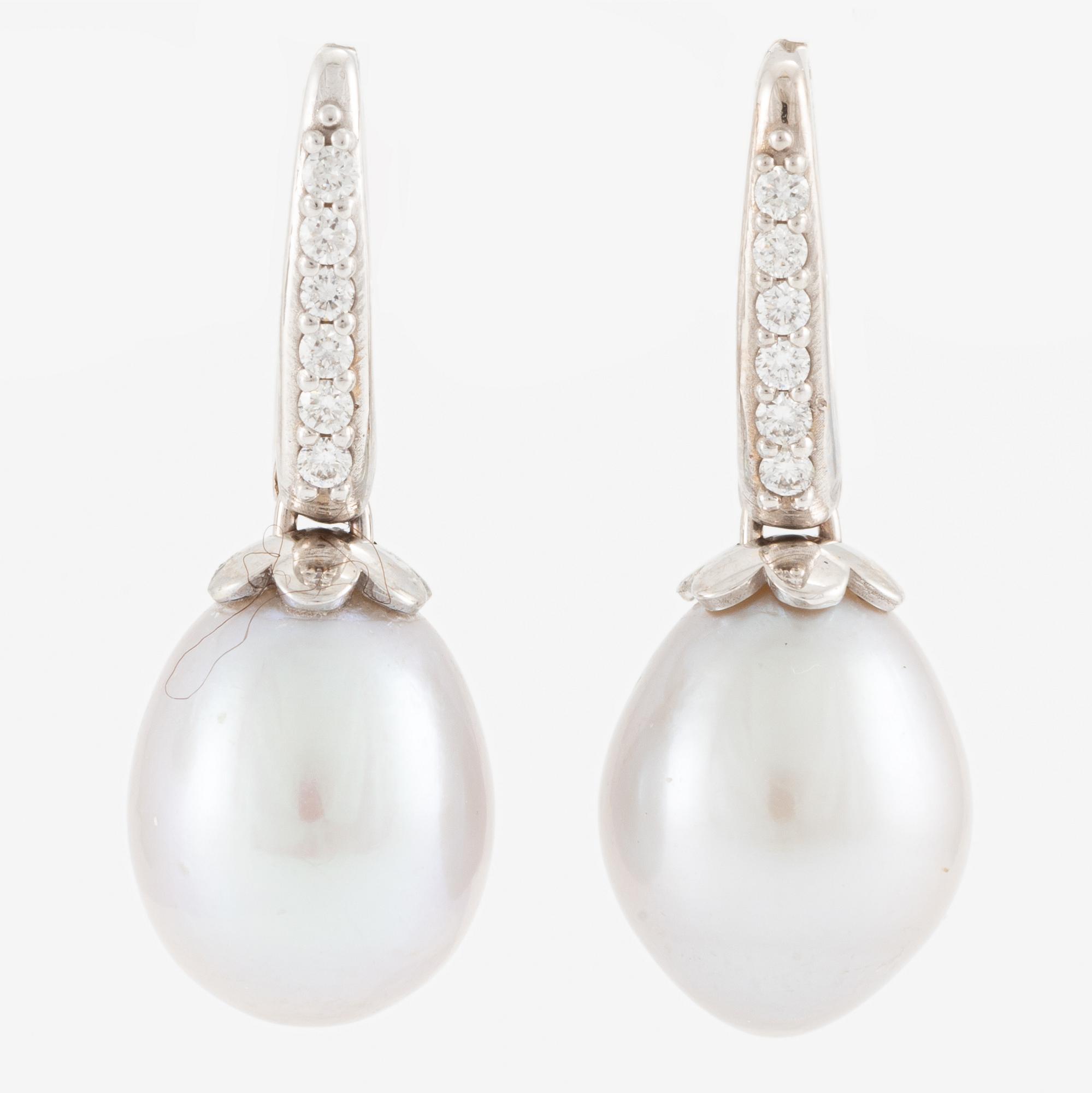 Earrings, 18K white gold with cultured drop-shaped freshwater pearls and brilliant-cut diamonds.
