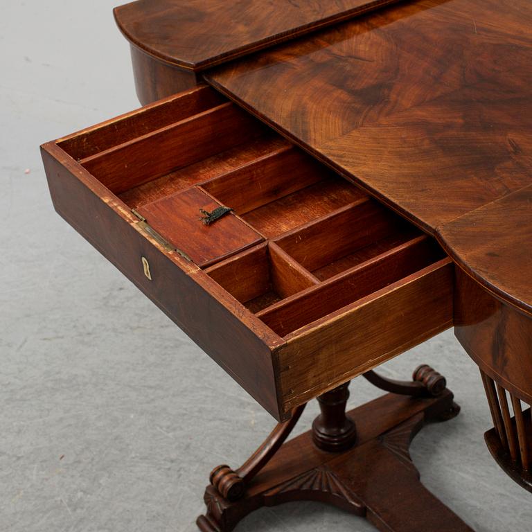 A sewing table, late Empire, 1830's.