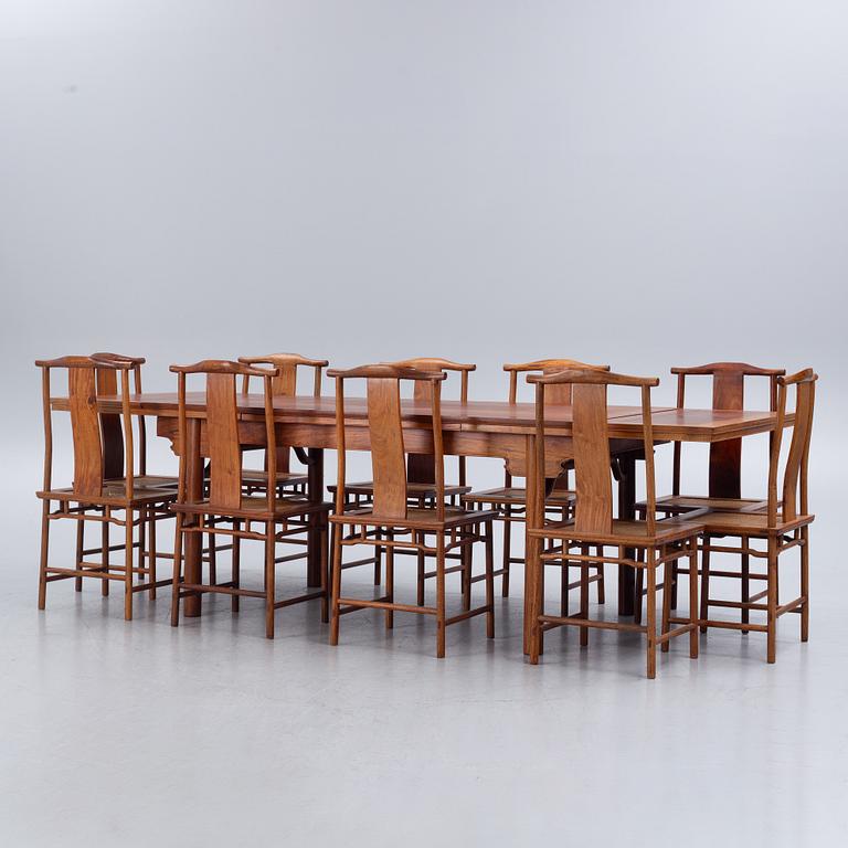 A Chinese hardwood dinner table and ten chairs with rattan seats, 20th century.