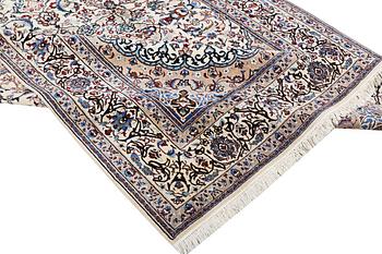 A Nain carpet, part silk, 9 laa, ca. 318 x 209 cm.