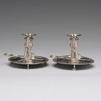 An English pair of 18th century silver chamber candlesticks, mark probobly of Ebenezer Coker, London 1770.