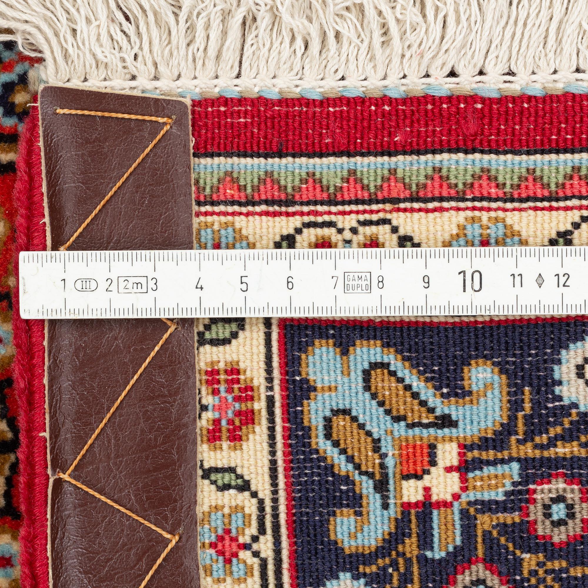 A Quum rug, ca 152 x 106 cm.