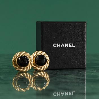 Earclips by Chanel.