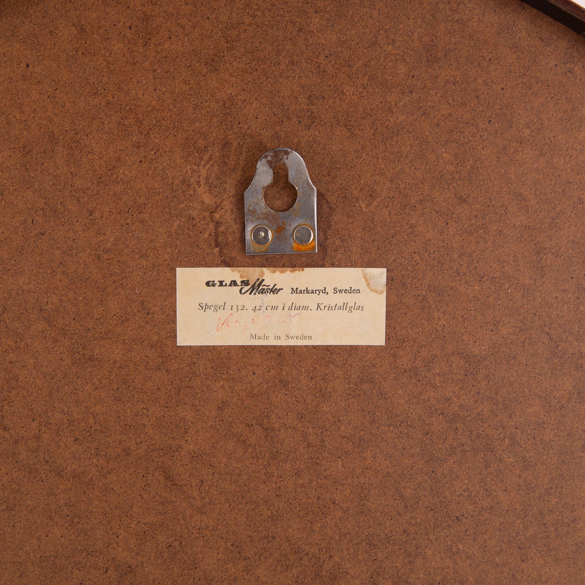 A copper ceiling lamp, by Fog & Mørup, Denmark, and a copper mirror, Markaryd.