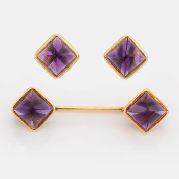 Brooch and earrings with cabochon cut amethysts.