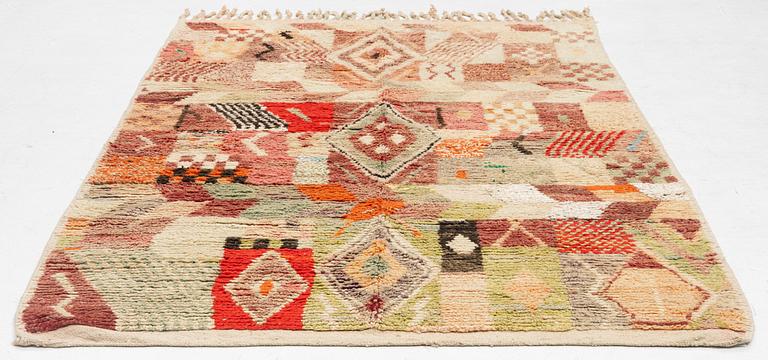 A Moroccan crpet, c. 240 (+7+8 cm flat weave) x 151 cm.
