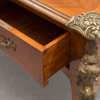 a rococo-style writing desk from the middle of the 20th century.