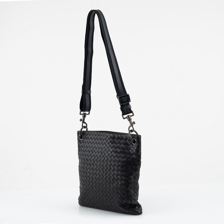 Bottega Veneta, a black intrecciato leather bag.