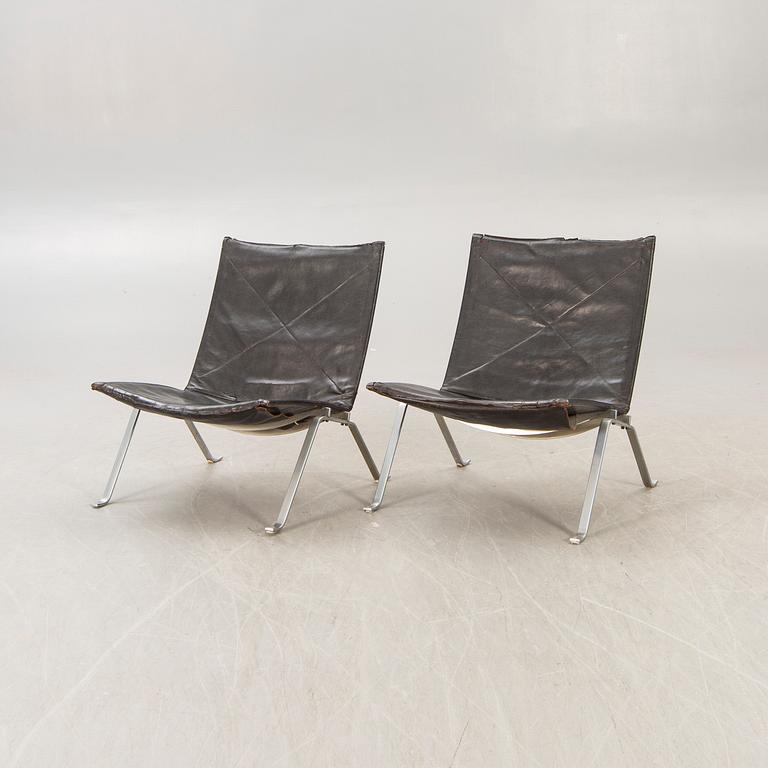 A pair of Poul Kjaerholm metal and leather PK22 easy chairs from Kold Christensen Denmark.