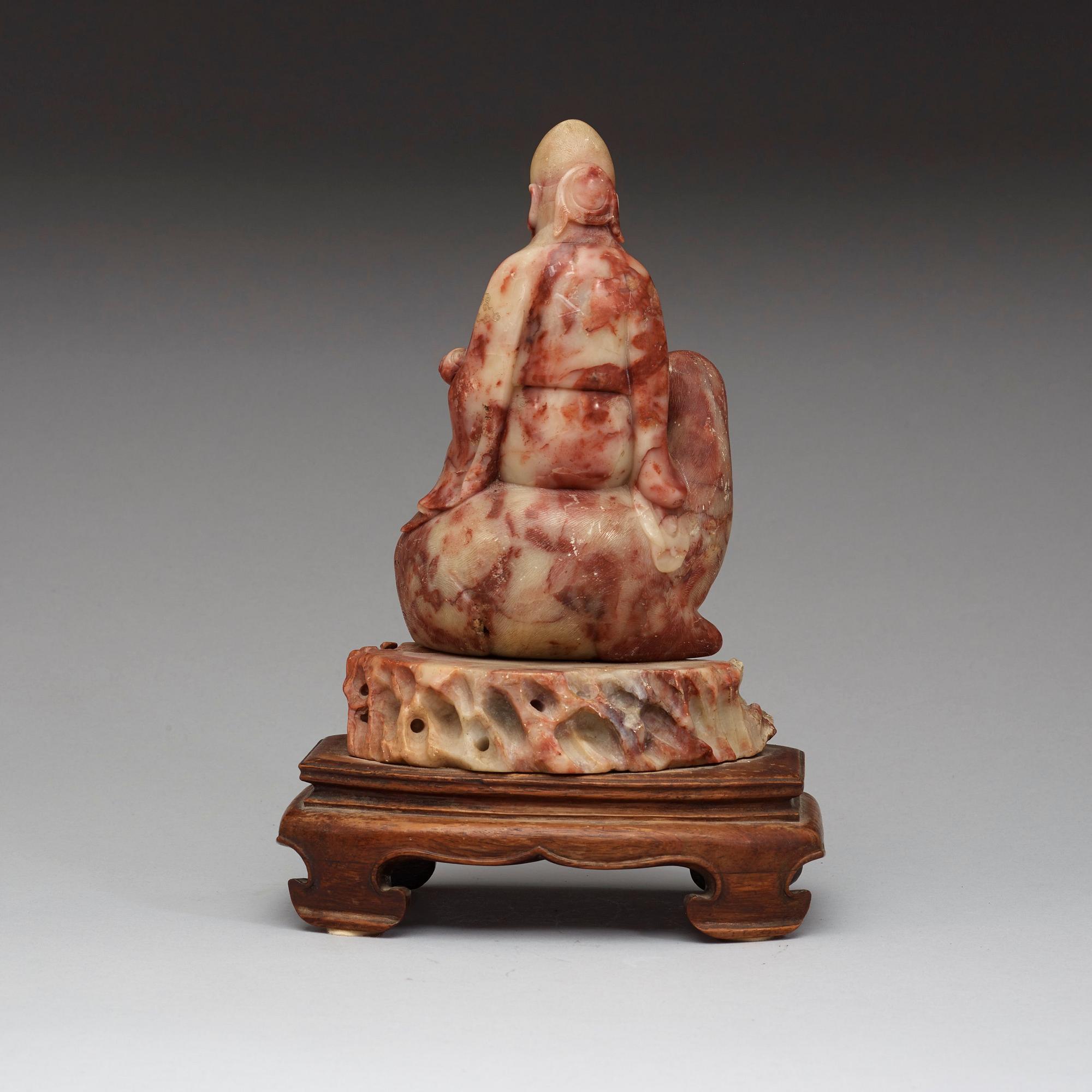 A soapstone figurine of Shoulao, Qing dynasty (1644-1912).