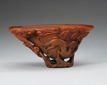 A finely carved rhinoceros libation cup, Qing dynasty, Kangxi (1662-1722).