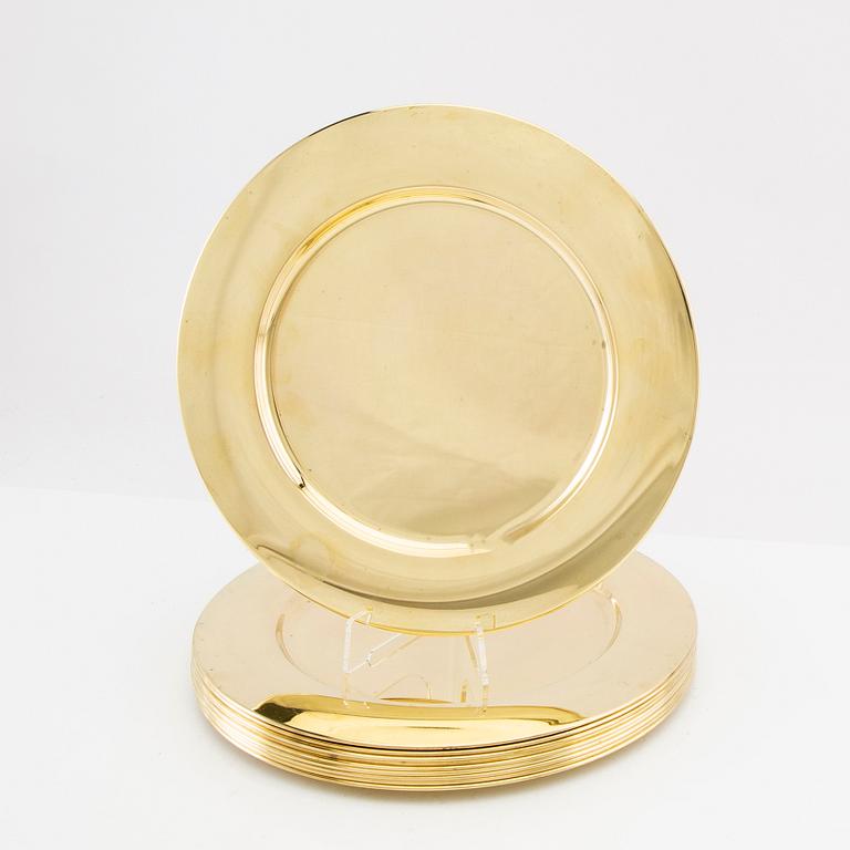 A set of 10 Stelton brass plates, Denmark, late 20th century.