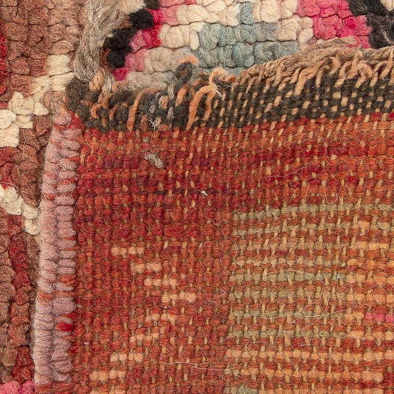 A rug semi-antique North africa, ca 275 x 185 cm.
