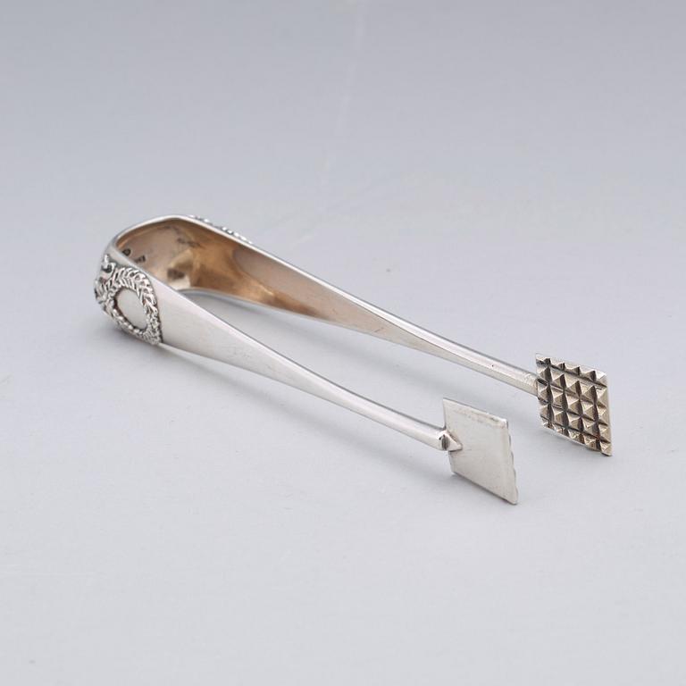 A Fabergé 20th century silver sugar-tongs, work master Anders Michelsen 1908-1917. Imperial Warrant.