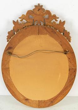 A Gustavian style mirror, mid 20th Century.