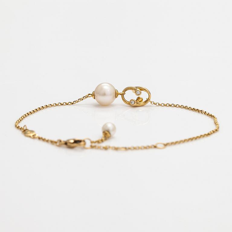 Georg Jensen, An 18K gold bracelet "Magic" with a cultured pearl and diamonds ca. 0.048 ct in total, Denmark.