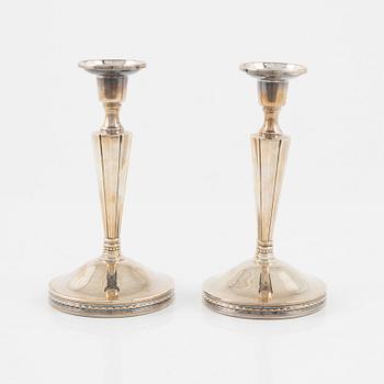 Eric Löfman, a pair of silver candlesticks, MGAB, Uppsala, 1976.