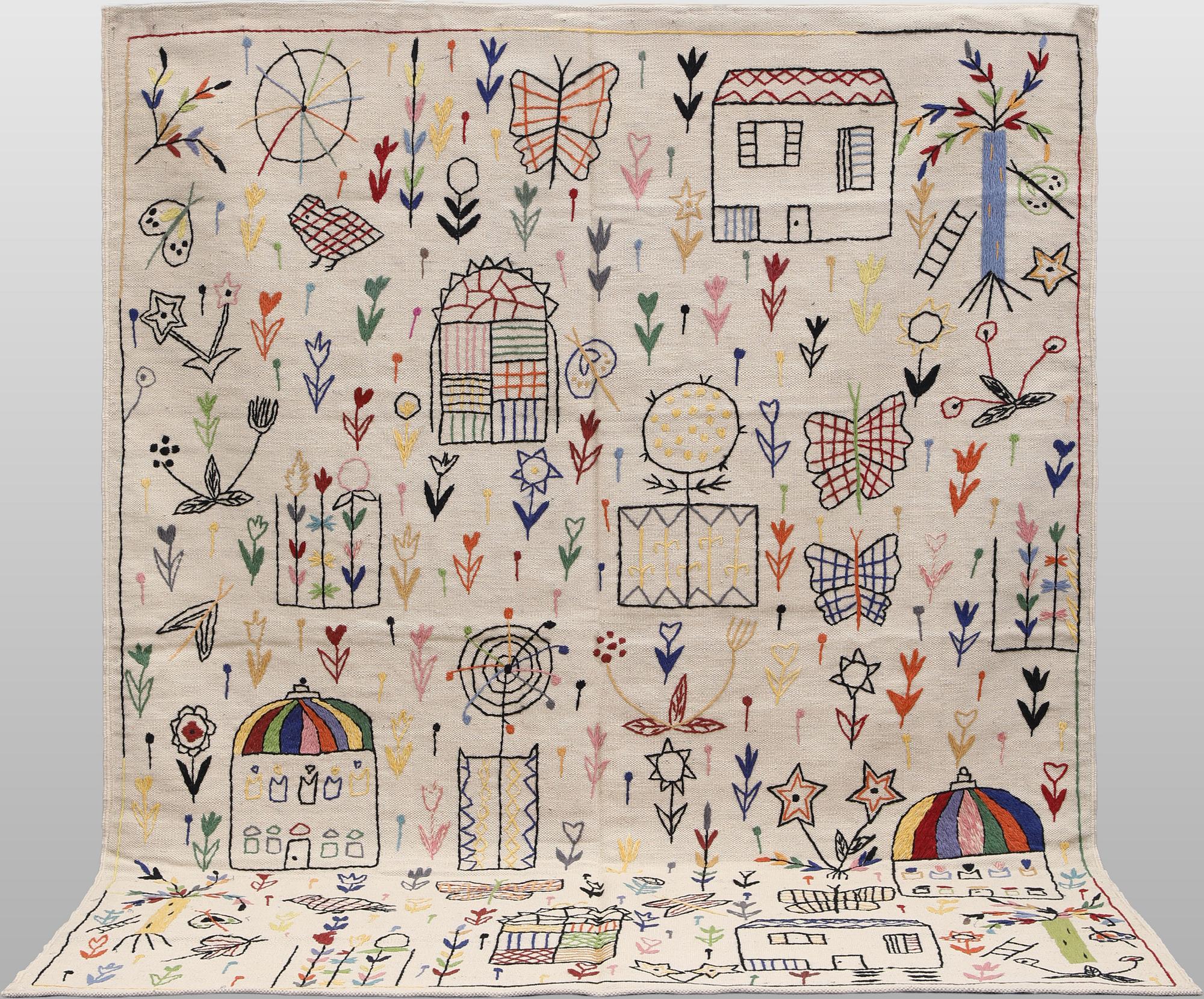 A Kelim carpet with hand-embroidered decoration, 239 x 182 cm.