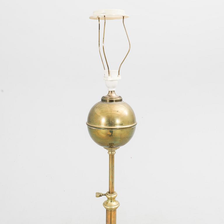 An early 1900s brass floor lamp.