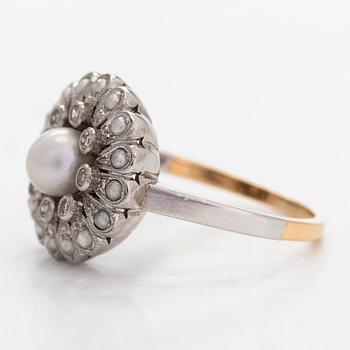 A platinum/18K gold flower ring, with cultured pearls, and eight-cut diamonds, A.Tillander.