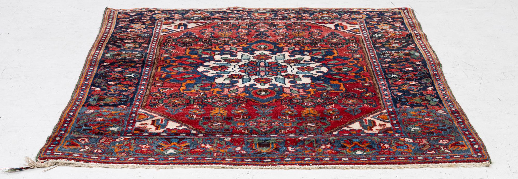 An Old Northwest Persian rug, c. 127 x 125 cm.