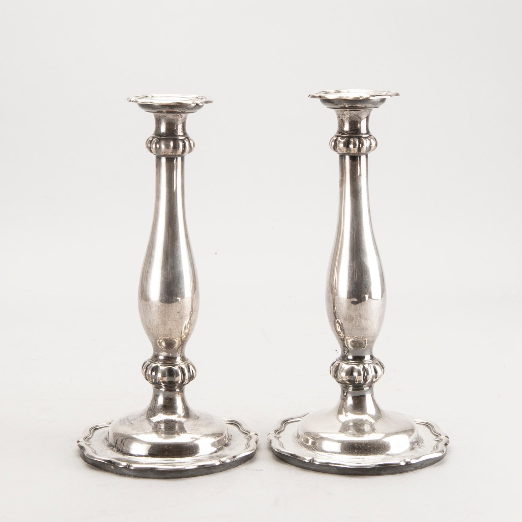 A pair of Austrian silver candle sticks Vienna 1852 weight 626 gr.