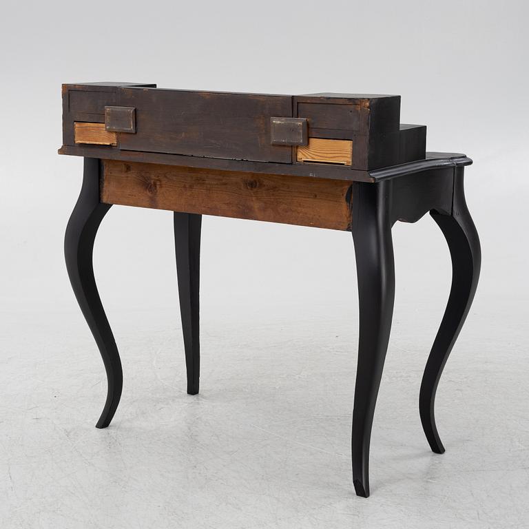 A painted rococo style writing desk, from around the year 1900.