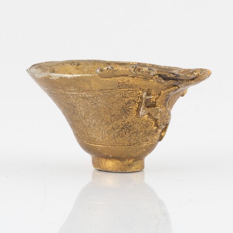 A gilt bronze libation cup, China, presumably 20th Century.