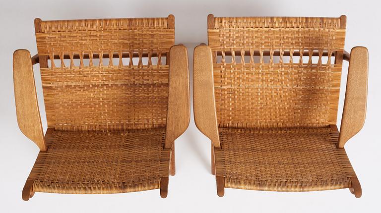 Hans J. Wegner, a pair of oak easy chairs 'CH27', Carl Hansen & Son, Denmark, 1950s.