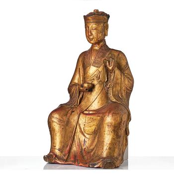 A large gilt lacquer figure of a deity, Vietnam, 19th century.