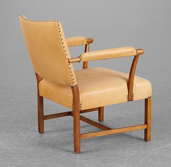 A Josef Frank mahogany and beige leather armchair, Svenskt Tenn.
