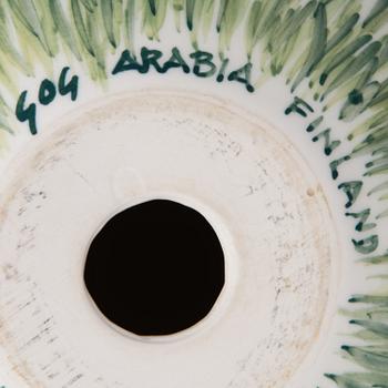 A porcelain egg signed GOG Arabia Finland.