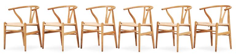 A set of six Hans J Wegner oak 'Wishbone chairs', Carl Hansen & Søn, Denmark.