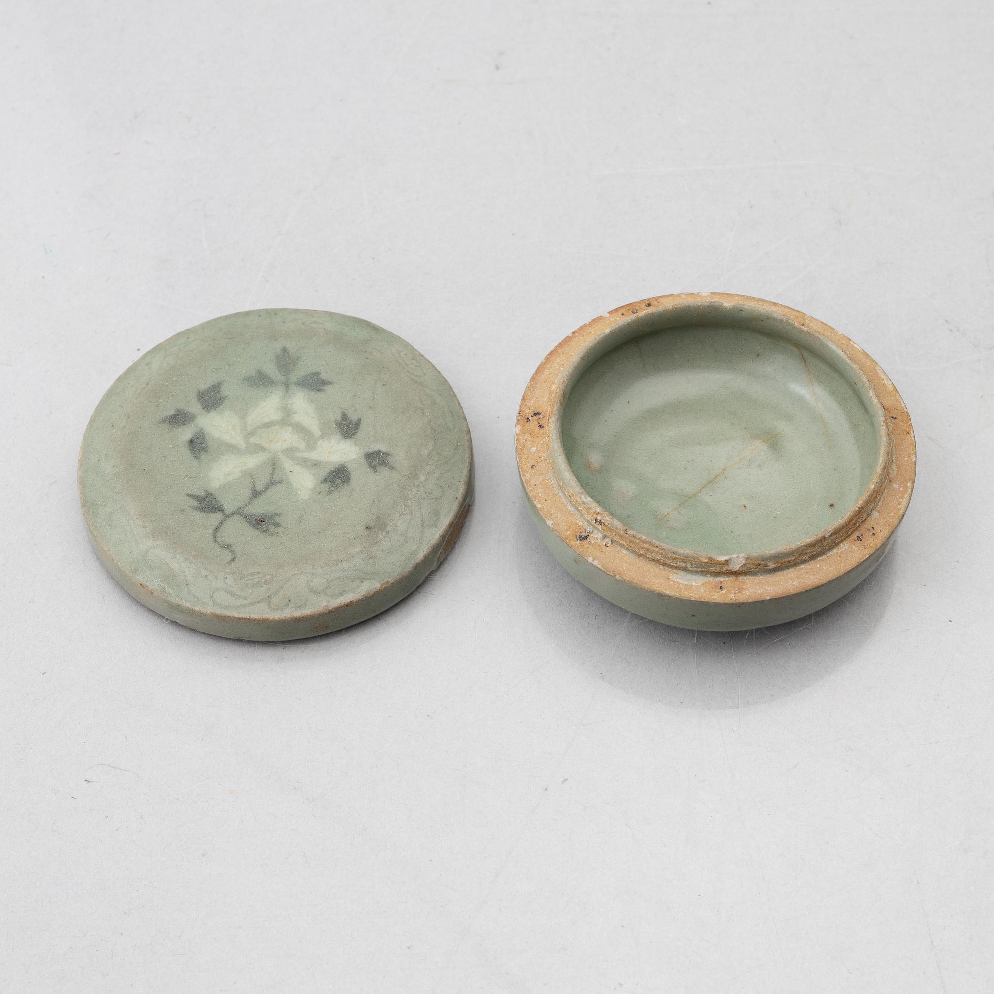 A Korean Celadon glazed box with cover, Koryo dynasty (918–1392).