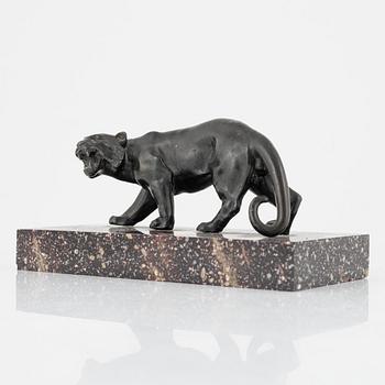 A porphyry paperweight with a bronze lion, 20th Century.