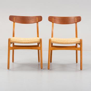 Hans J Wegner, a set of six beech and teak model CH-23 chairs, Denmark.