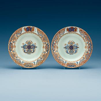 1546. A pair of enamelled armorial soup dishes, Qing dynasty, Yongzheng (1723-35).