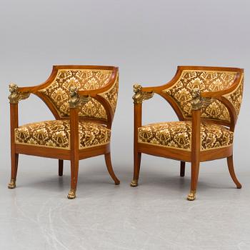 A circa 1900 sofa, two easy chairs and a table.