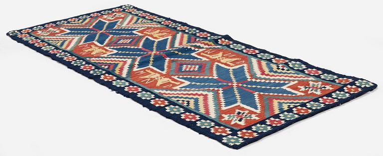 A flat weave carriage cushion, c. 116 x 48 cm, Färs district, Southwest Scania, Sweden, first part of the 19th century.