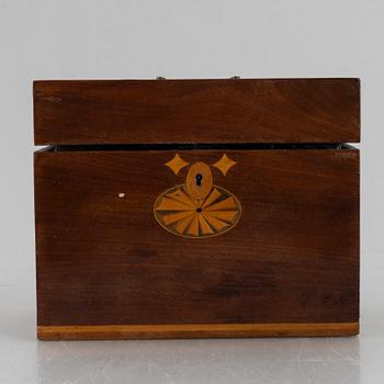 A wooden box with three glass flaska, first half of the 19th century.