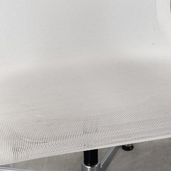 A pair of 'EA 108' desk chairs by Charles & Ray Eames for Vitra.