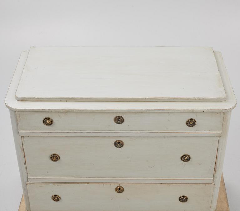 A chest of drawers, circa 1900.