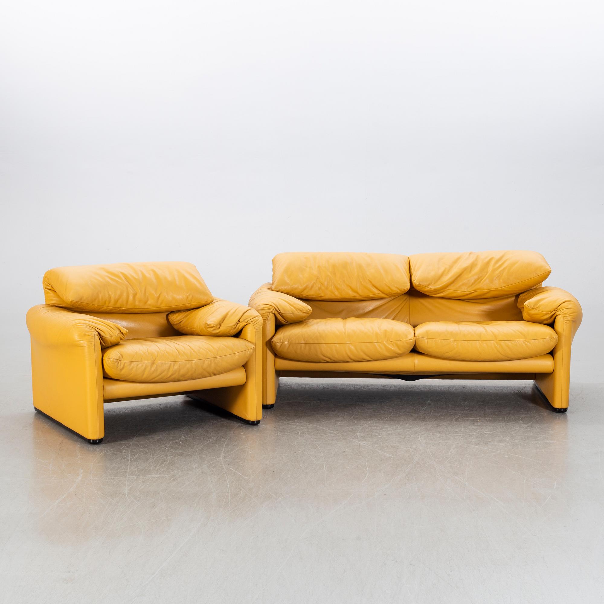 A "Maralunga" leather sofa and easy chair by Vico Magistretti, Italy.
