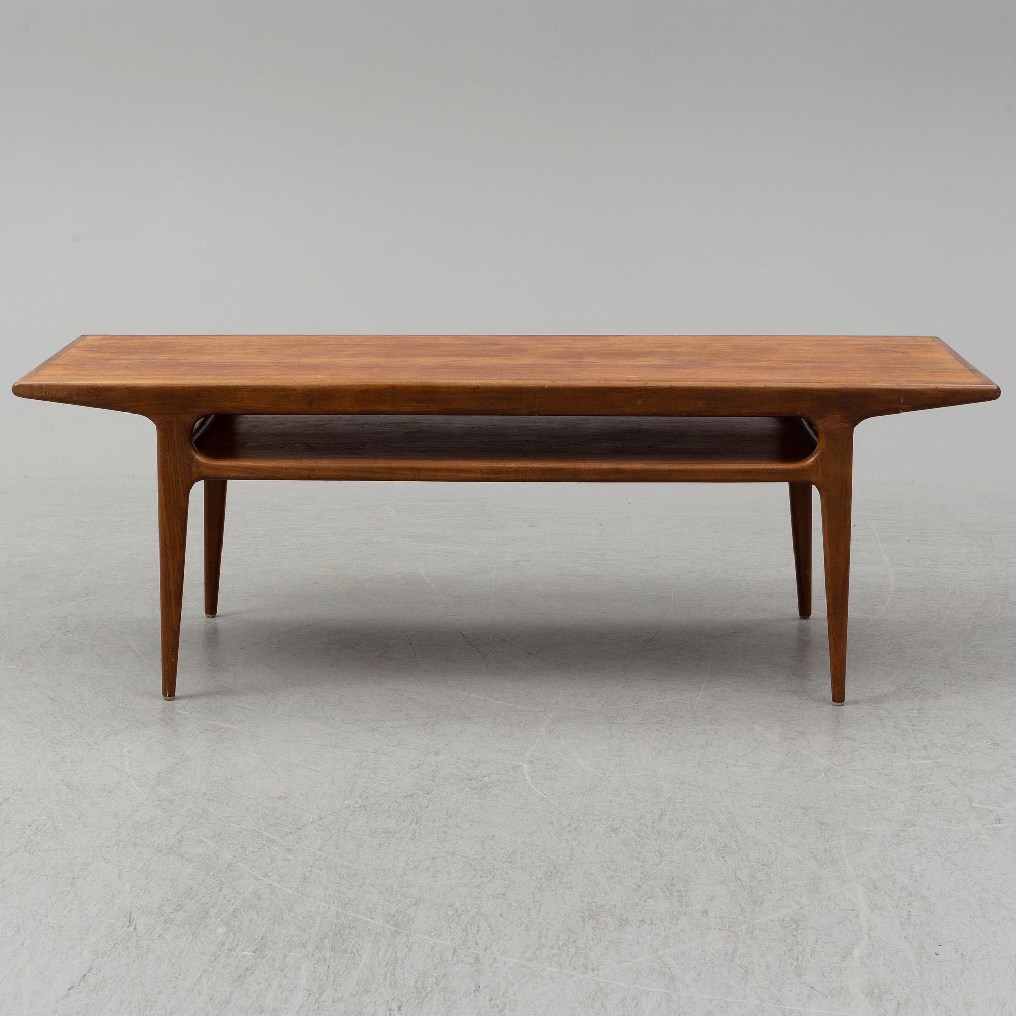 A 1960s teak coffee table.